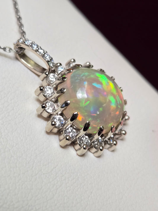 14K white gold pendant with a 4ct round opal, featuring a delicate design from Chique Jewelry.