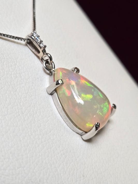 14K white gold pendant featuring a 3ct pear-shaped opal gemstone, crafted by Chique Jewelry.