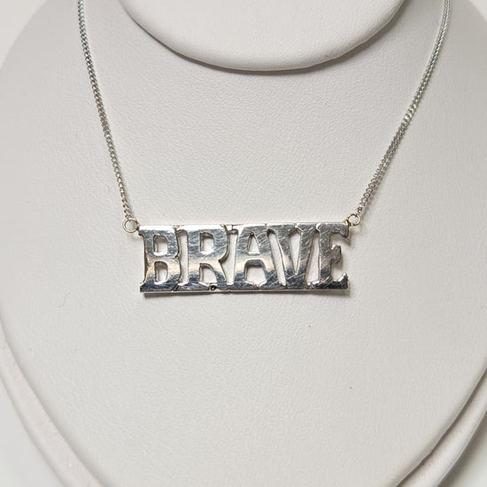 14K white gold diamond cut curb chain necklace with "Brave" pendant, 19 inches long, 3.2 grams from Chique Jewelry.