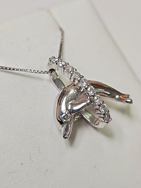 14K white gold dolphin pendant with 0.18ct round diamonds, weighing 2.4g, from Chique Jewelry.