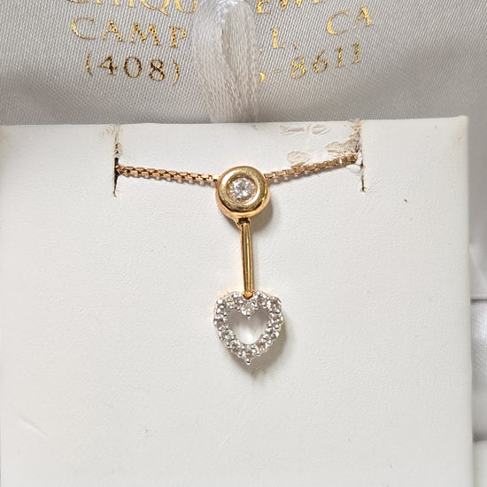 18K gold pendant with 0.23 carat round diamonds from Chique Jewelry, showcasing a elegant jewelry piece with a delicate design.