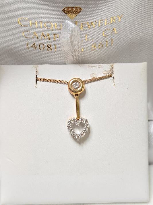18K gold pendant with 0.23 carat round diamonds from Chique Jewelry, showcasing a elegant jewelry piece with a delicate design.