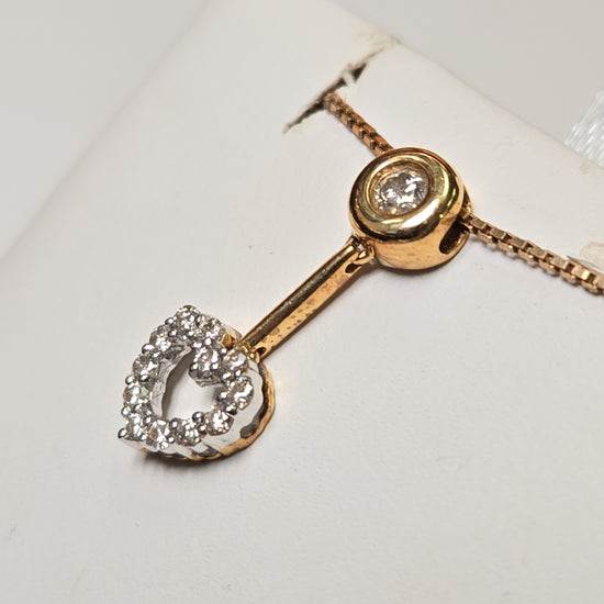 18K gold pendant with 0.23ct round diamonds from Chique Jewelry, showcasing a delicate, elegant jewelry piece.