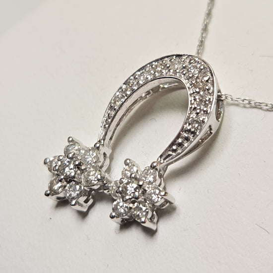 14K white gold pendant with 0.44ct round diamond, featuring elegant jewelry design, weighing 1.5 grams.
