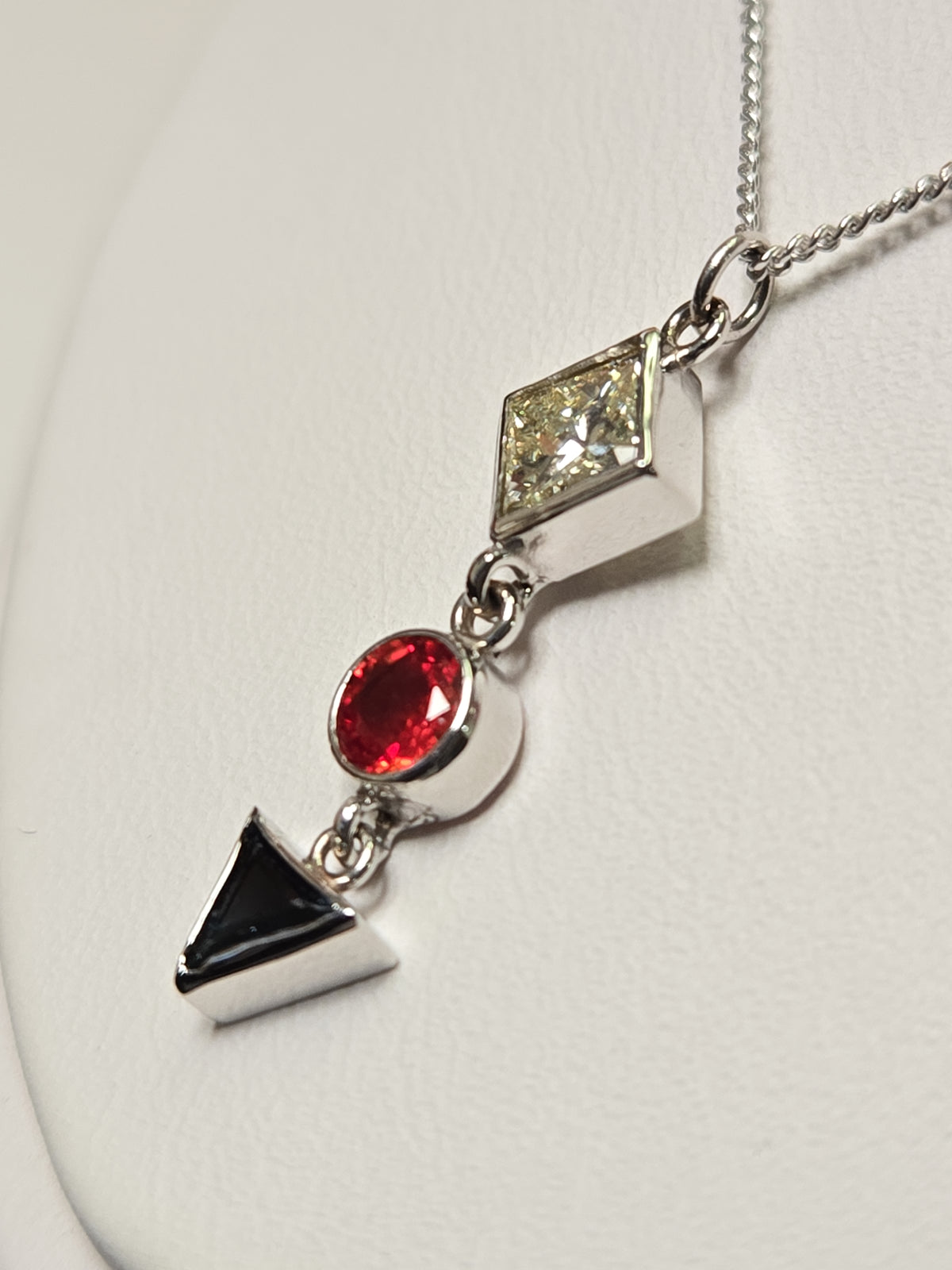 14K white gold pendant necklace with a 0.49ct princess-cut diamond, 2.1g, by Chique Jewelry.