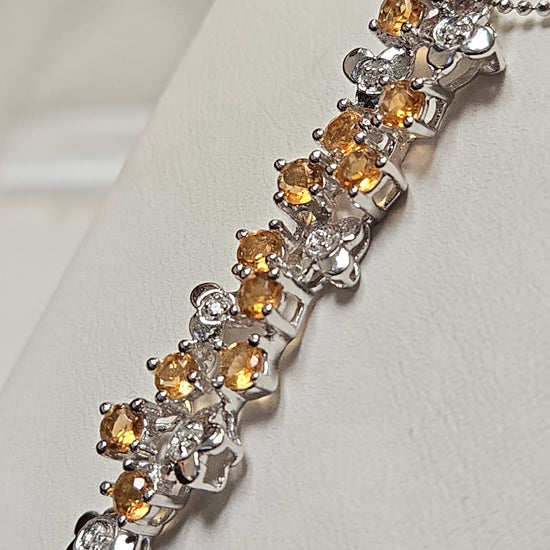 14K white gold pendant featuring round citrine gemstones, weighing 3.8 grams, from Chique Jewelry.