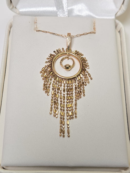 18K gold tassel pendant from Chique Jewelry, weighing 2.1g, featuring a delicate hanging design with intricate detailing.