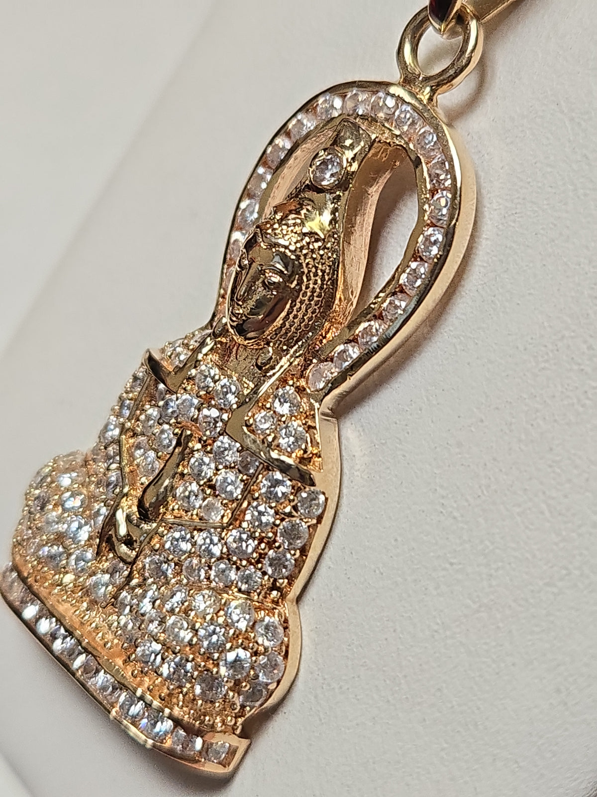 14K gold pendant with round cubic zirconia, weighing 7.9 grams, from Chique Jewelry, featuring a sparkling gemstone design.
