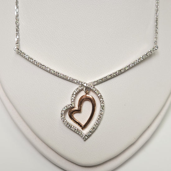 14K white gold heart pendant with 0.19ct round diamond from Chique Jewelry, showcasing the elegant jewelry design.