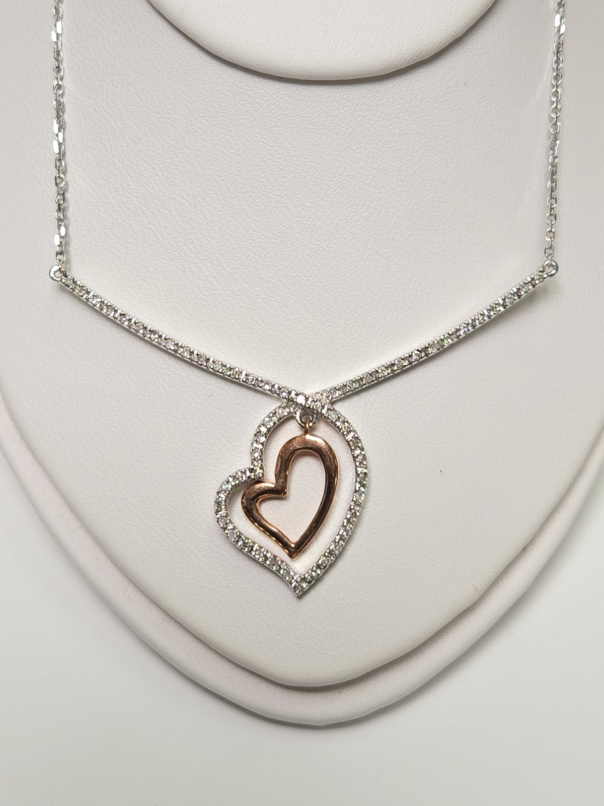 14K white gold heart pendant with 0.19ct round diamond from Chique Jewelry, showcasing the elegant jewelry design.