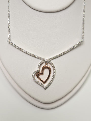 14K white gold heart pendant with 0.19ct round diamond from Chique Jewelry, showcasing the elegant jewelry design.