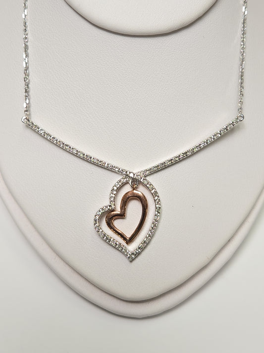14K white gold heart pendant with 0.19ct round diamond from Chique Jewelry, showcasing the elegant jewelry design.