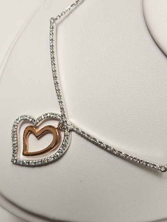 14K white gold heart pendant with 0.19ct round diamond, elegant jewelry piece from Chique Jewelry.