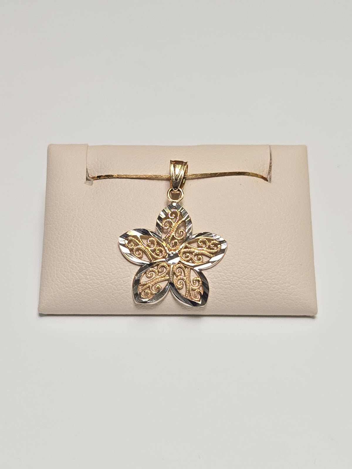 14K gold filigree flower pendant with delicate design, weighing 0.7g, from Chique Jewelry.