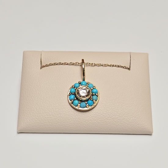 14K gold pendant with round simulated diamond, weighing 1.2g, featuring a sparkling jewelry design by Chique Jewelry.