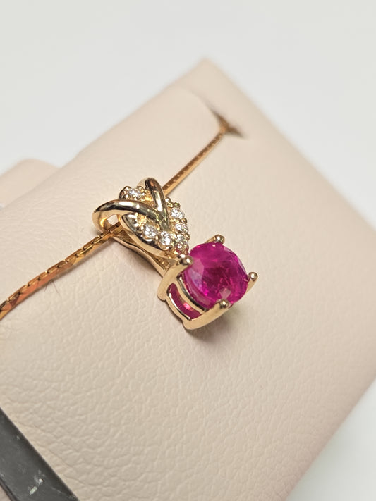 14K gold pendant featuring a 0.67ct round ruby and delicate design, weighing 0.8g, from Chique Jewelry.