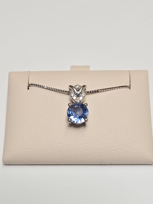 14K white gold pendant featuring a 0.72ct round sapphire, from Chique Jewelry, with a delicate and elegant design.