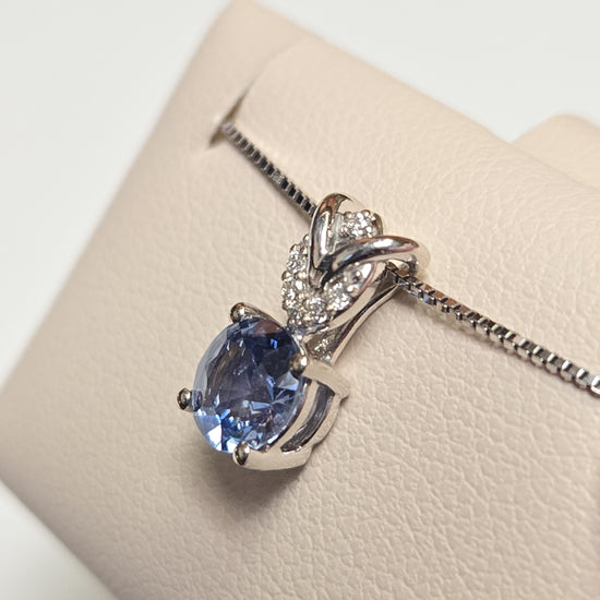 14K white gold pendant featuring a 0.72ct round sapphire, from Chique Jewelry, showcasing the elegant jewelry design.