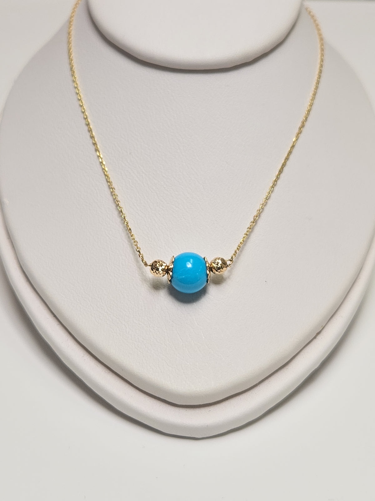 14K gold pendant necklace with round turquoise gemstone, handcrafted by Chique Jewelry, weighs 1.6 grams.