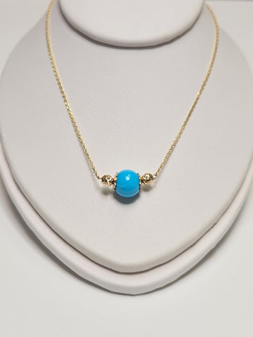 14K gold pendant necklace with round turquoise gemstone, handcrafted by Chique Jewelry, weighs 1.6 grams.