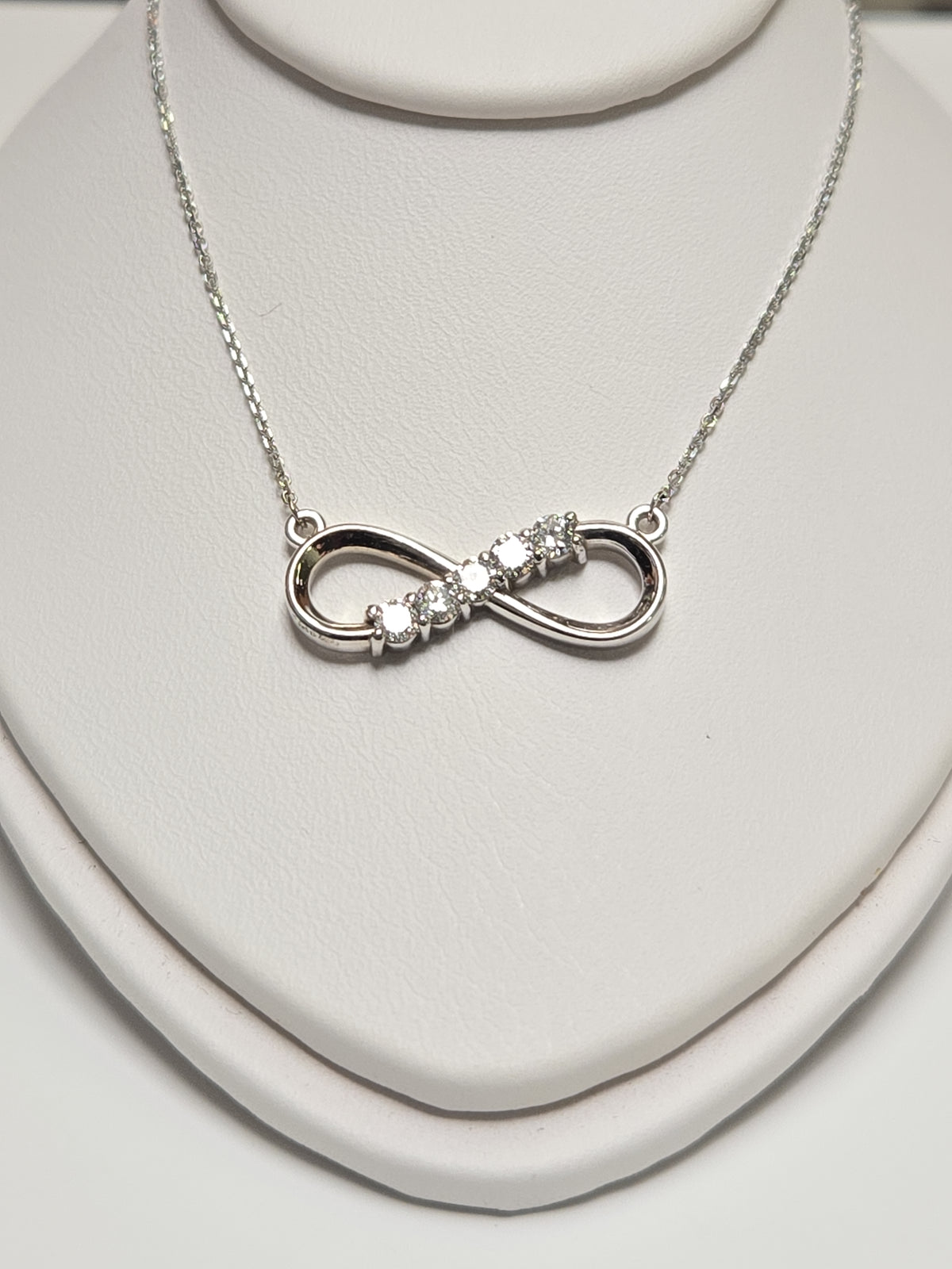 14K white gold infinity pendant necklace with lab-created diamonds, weighing 2.9g, showcasing elegant jewelry design.