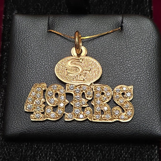 14K gold 49ers pendant with 1.1ct round diamond, crafted by Chique Jewelry, featuring a detailed sports team design.