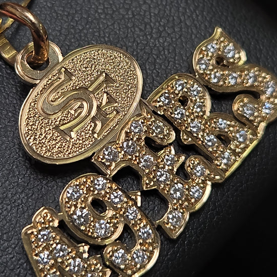 14K gold 49ers pendant with 1.1ct round diamond, crafted by Chique Jewelry, featuring a detailed sports team design.