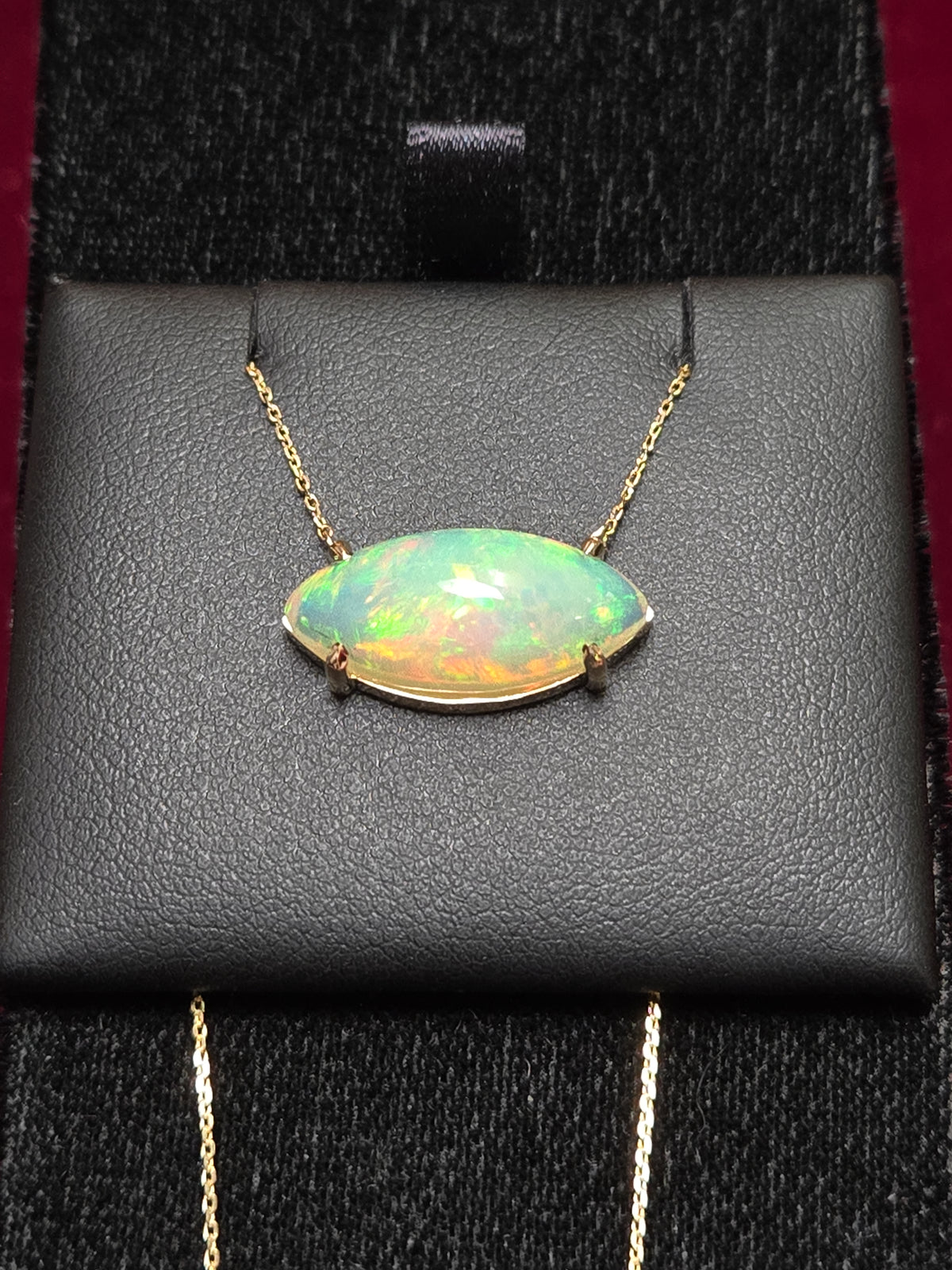 14K gold diamond cut cable chain necklace with 4.5ct marquise opal pendant, 18-inch length, by Chique Jewelry.