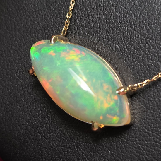 14K gold cable chain necklace with marquise opal pendant and diamond cut design, 18-inch length, from Chique Jewelry.