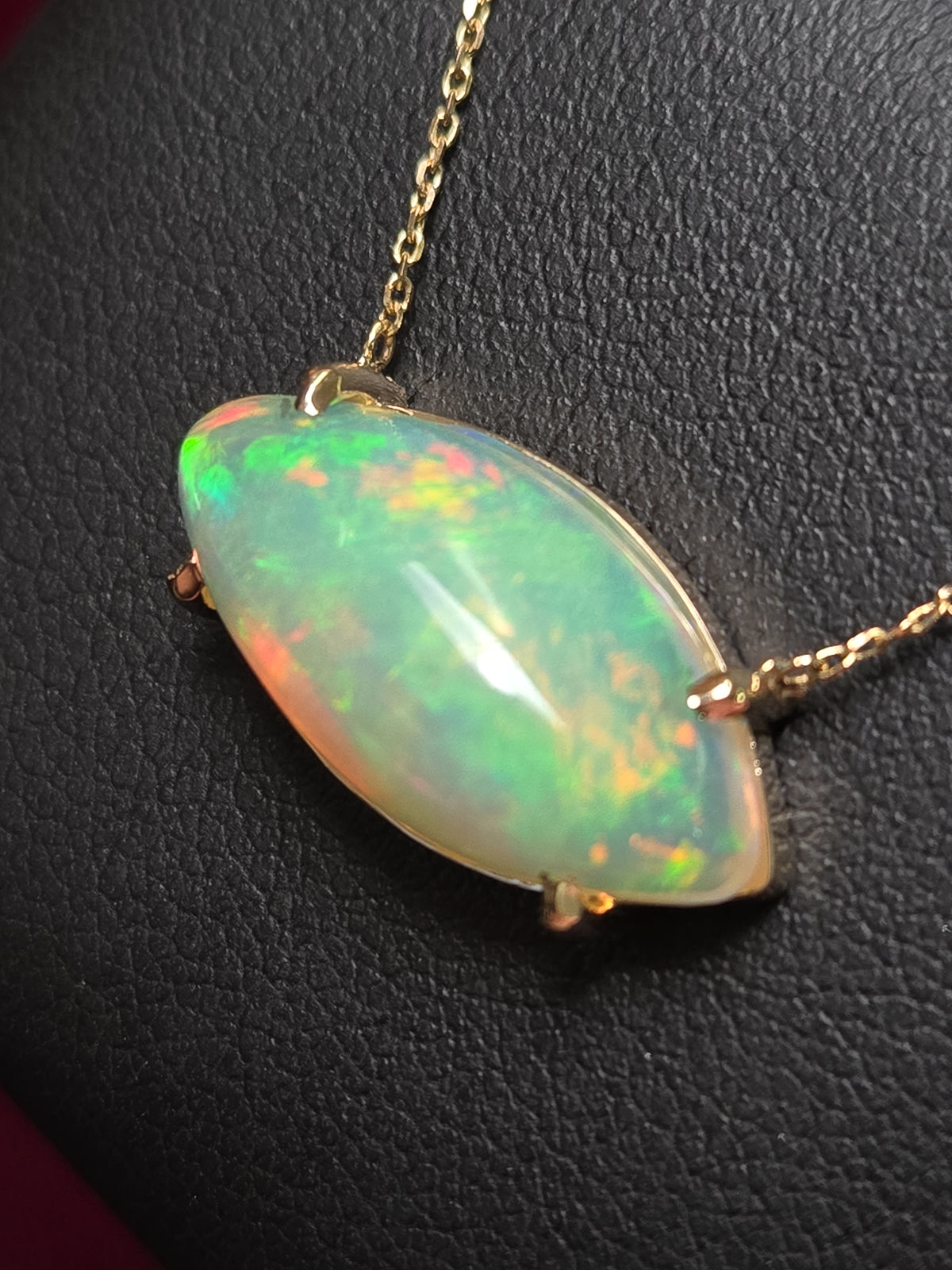14K gold cable chain necklace with marquise opal pendant and diamond cut design, 18-inch length, from Chique Jewelry.