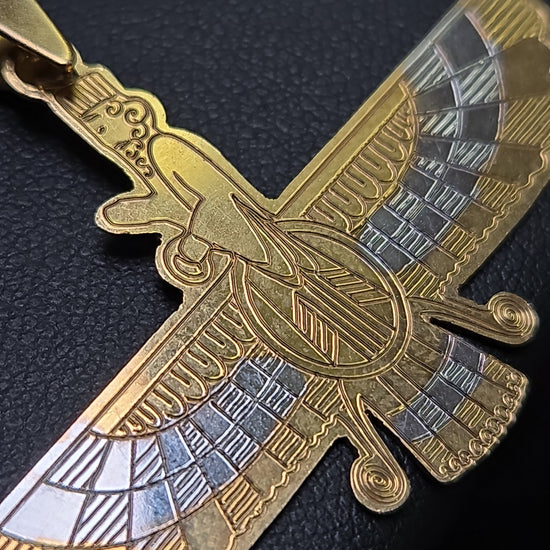 18K multi-tone gold Farvahar pendant from Chique Jewelry, showcasing intricate design and polished finish on a chain.