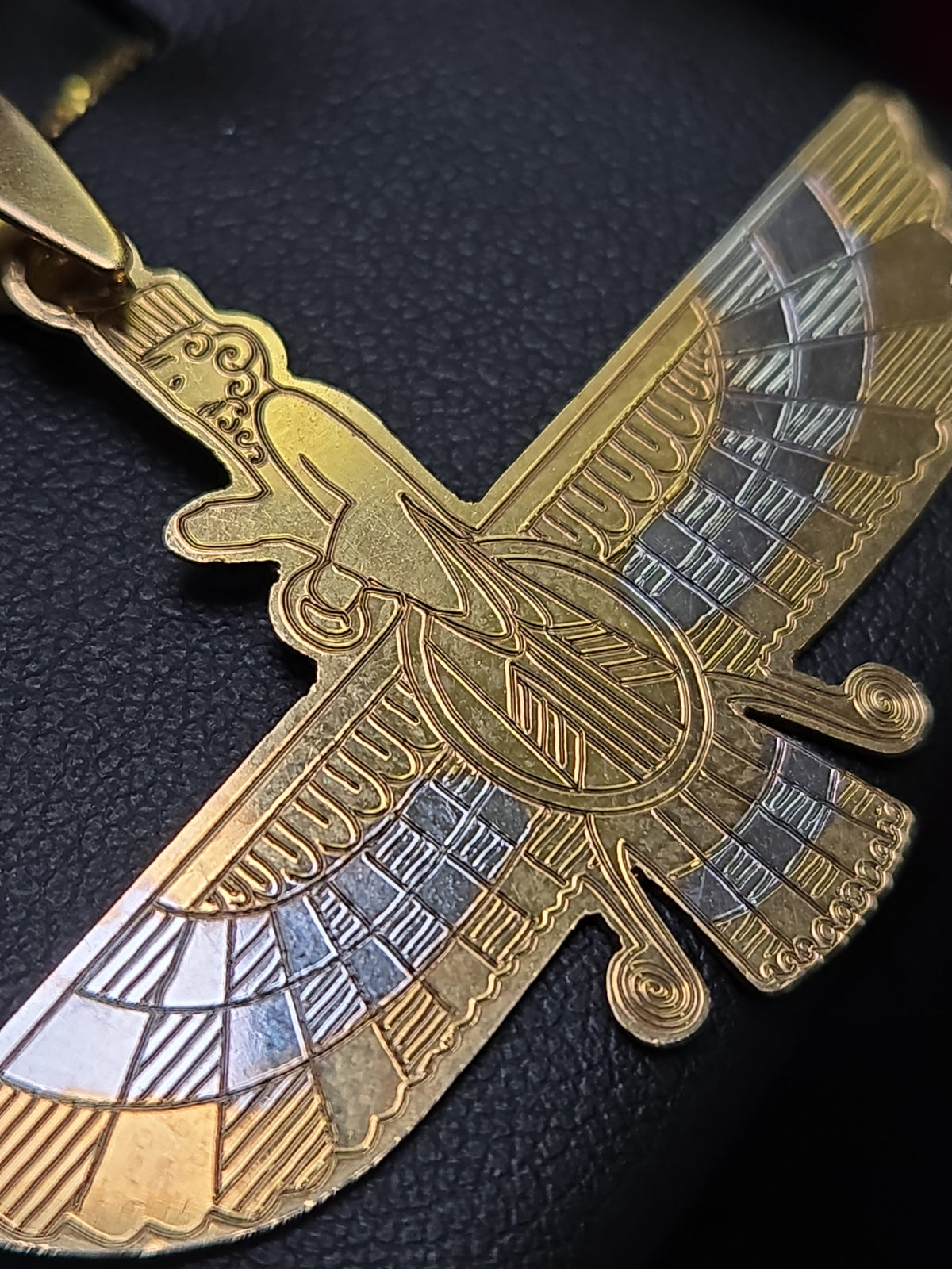 18K multi-tone gold Farvahar pendant from Chique Jewelry, showcasing intricate design and polished finish on a chain.