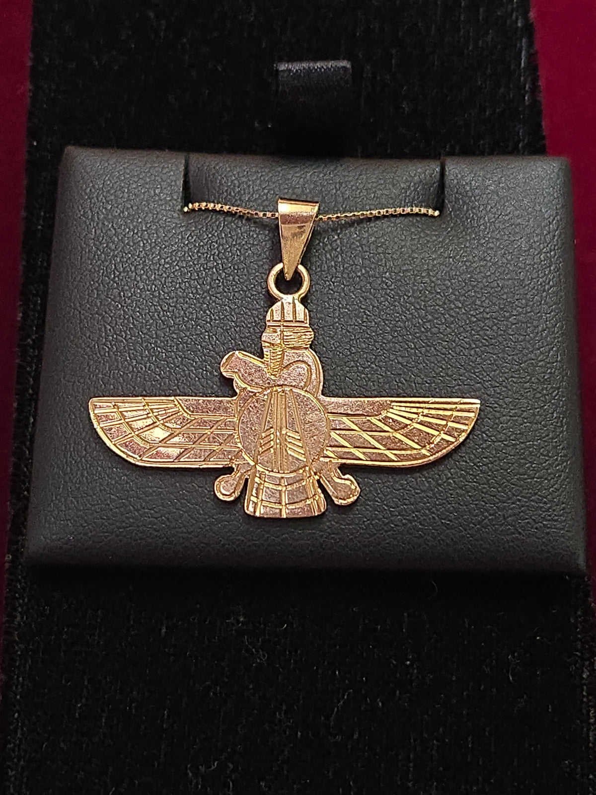 18K gold Farvahar pendant by Chique Jewelry, featuring intricate design, weighs 4.4 grams, displayed on a chain.