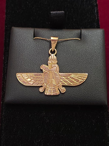 18K gold Farvahar pendant by Chique Jewelry, featuring intricate design, weighs 4.4 grams, displayed on a chain.