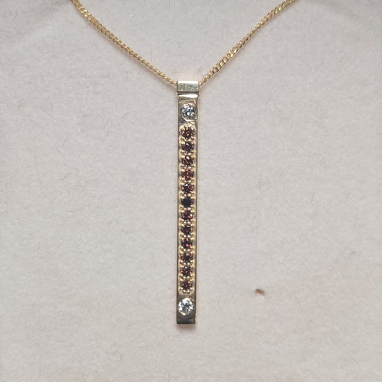 14K gold pendant featuring a 0.16ct round treated orange diamond, crafted by Chique Jewelry.