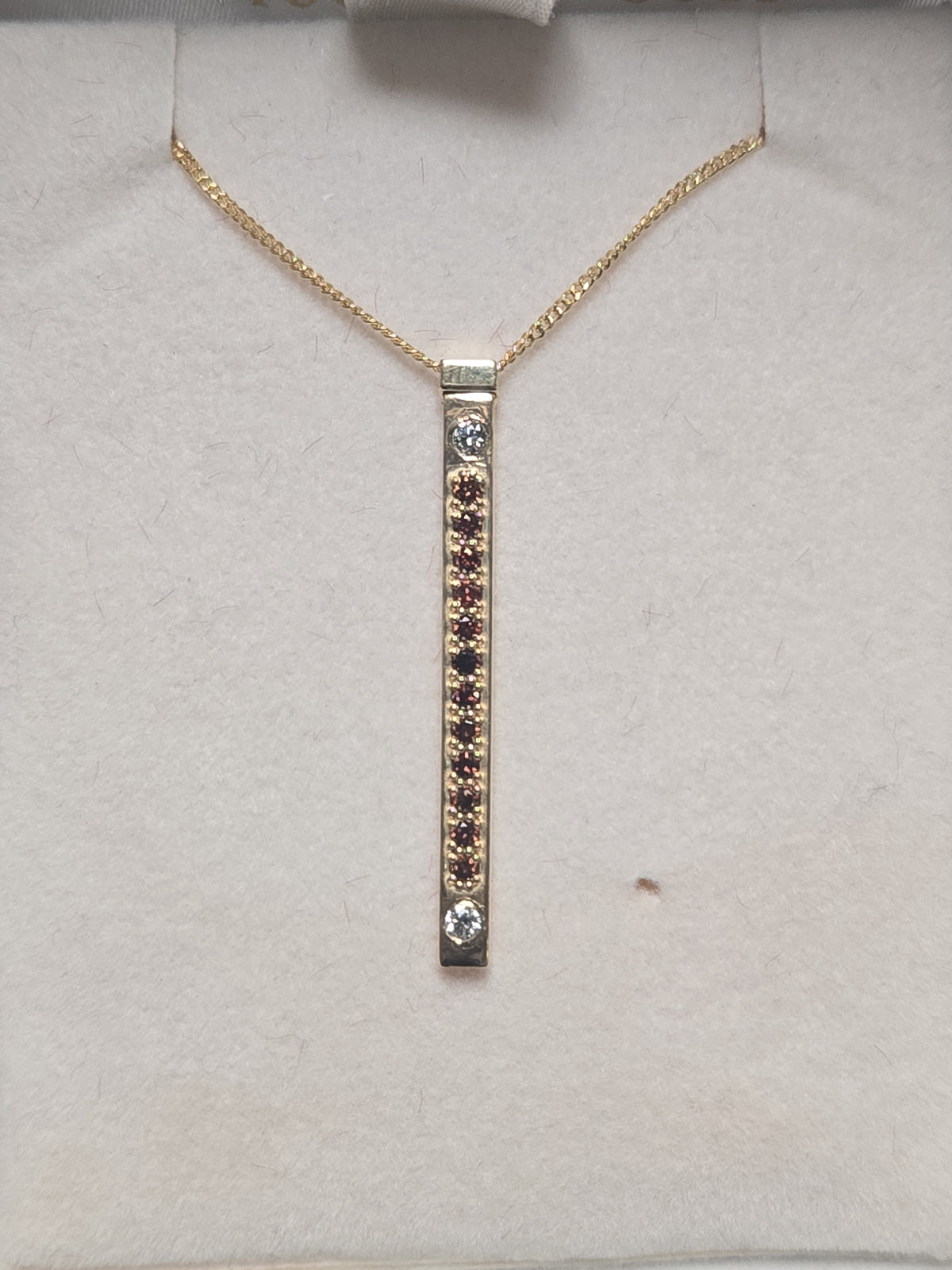 14K gold pendant featuring a 0.16ct round treated orange diamond, crafted by Chique Jewelry.