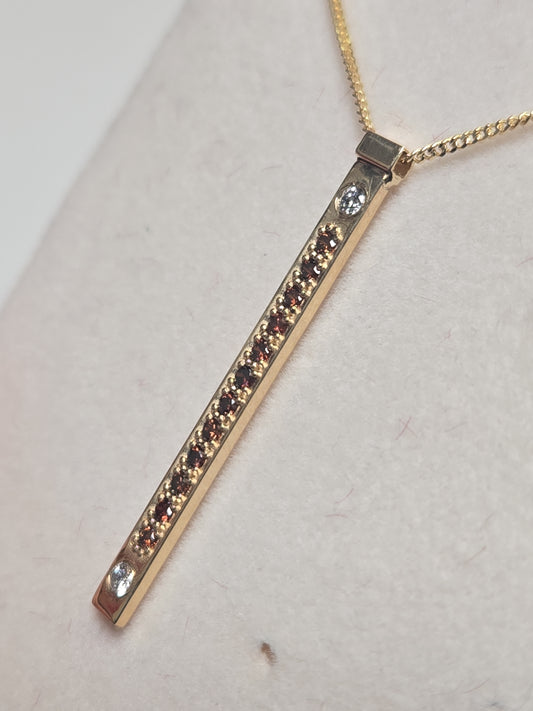 14K gold pendant featuring a 0.16ct round treated orange diamond, crafted by Chique Jewelry with a delicate design.