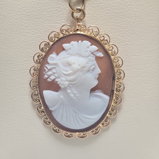 14K gold shell cameo pendant with detailed carved design, weighs 4.1 grams, from Chique Jewelry.