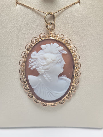 14K gold shell cameo pendant with detailed carved design, weighs 4.1 grams, from Chique Jewelry.