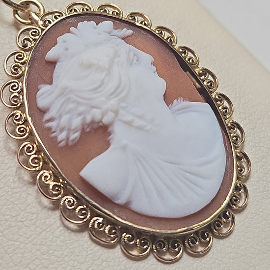 14K gold shell cameo pendant featuring intricate carved design, weighs 4.1 grams, by Chique Jewelry.