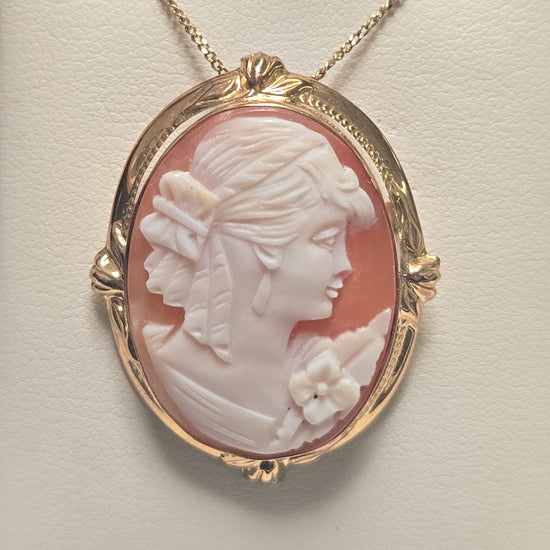 14K gold cameo brooch pendant with intricate carved cameo design, weighing 6.7 grams, from Chique Jewelry.