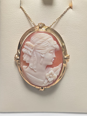 14K gold cameo brooch pendant with intricate carved cameo design, weighing 6.7 grams, from Chique Jewelry.