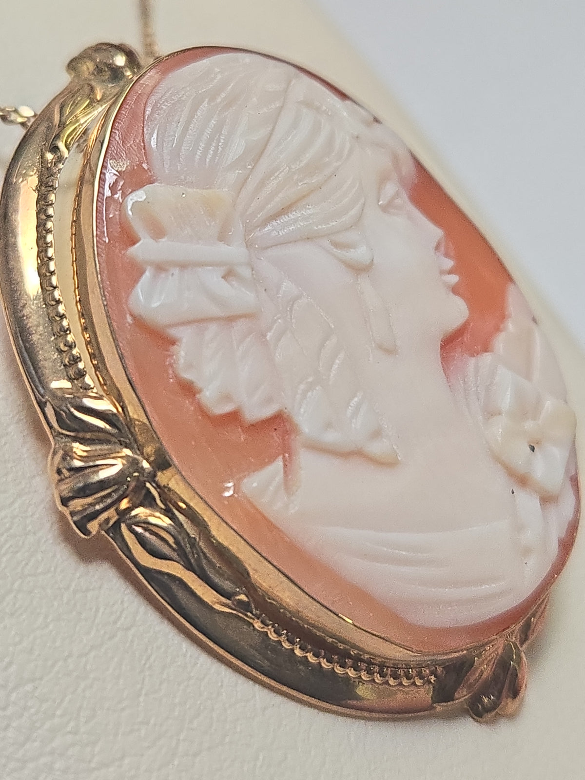 14K gold cameo brooch pendant with detailed carved cameo design, weighing 6.7 grams, by Chique Jewelry.
