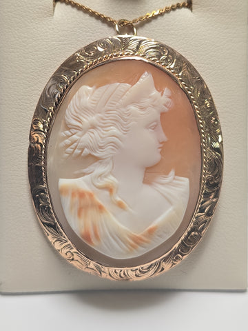 14K gold cameo brooch pendant with intricate carved profile, weighing 10g, by Chique Jewelry, showcasing elegant vintage craftsmanship.