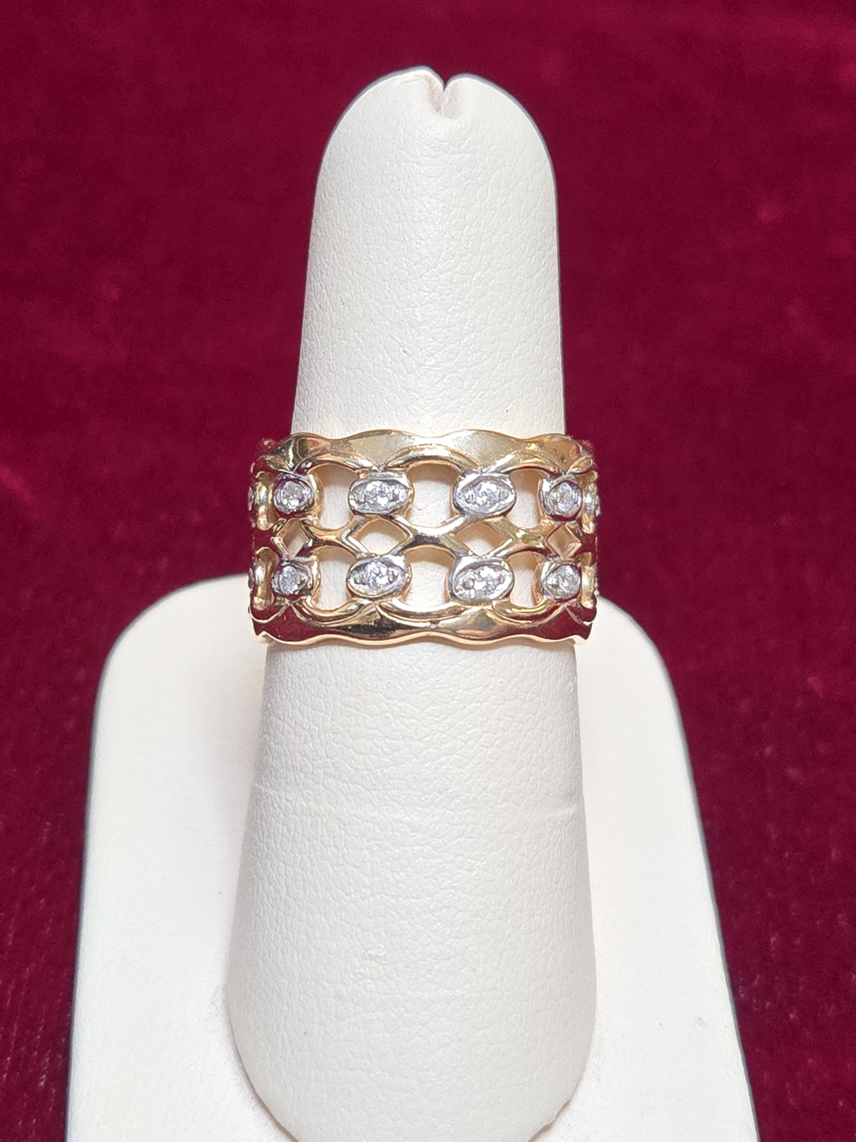 14K gold ring with a round white sapphire gemstone, featuring a polished band, by Chique Jewelry.