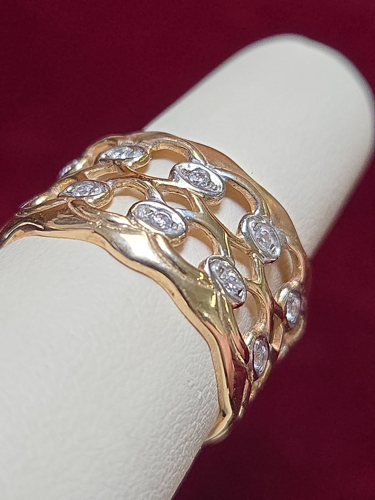 14K gold ring with round white sapphire gemstone from Chique Jewelry, showcasing the elegant design and polished finish.