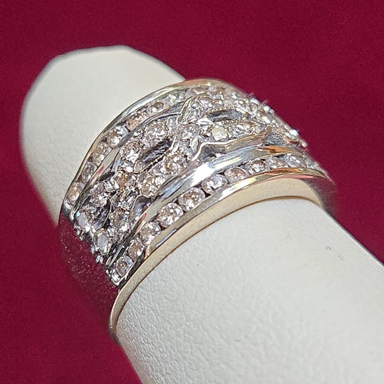 14K white gold ring with 0.6ct round diamonds from Chique Jewelry, showcasing a sparkling diamond-studded band.