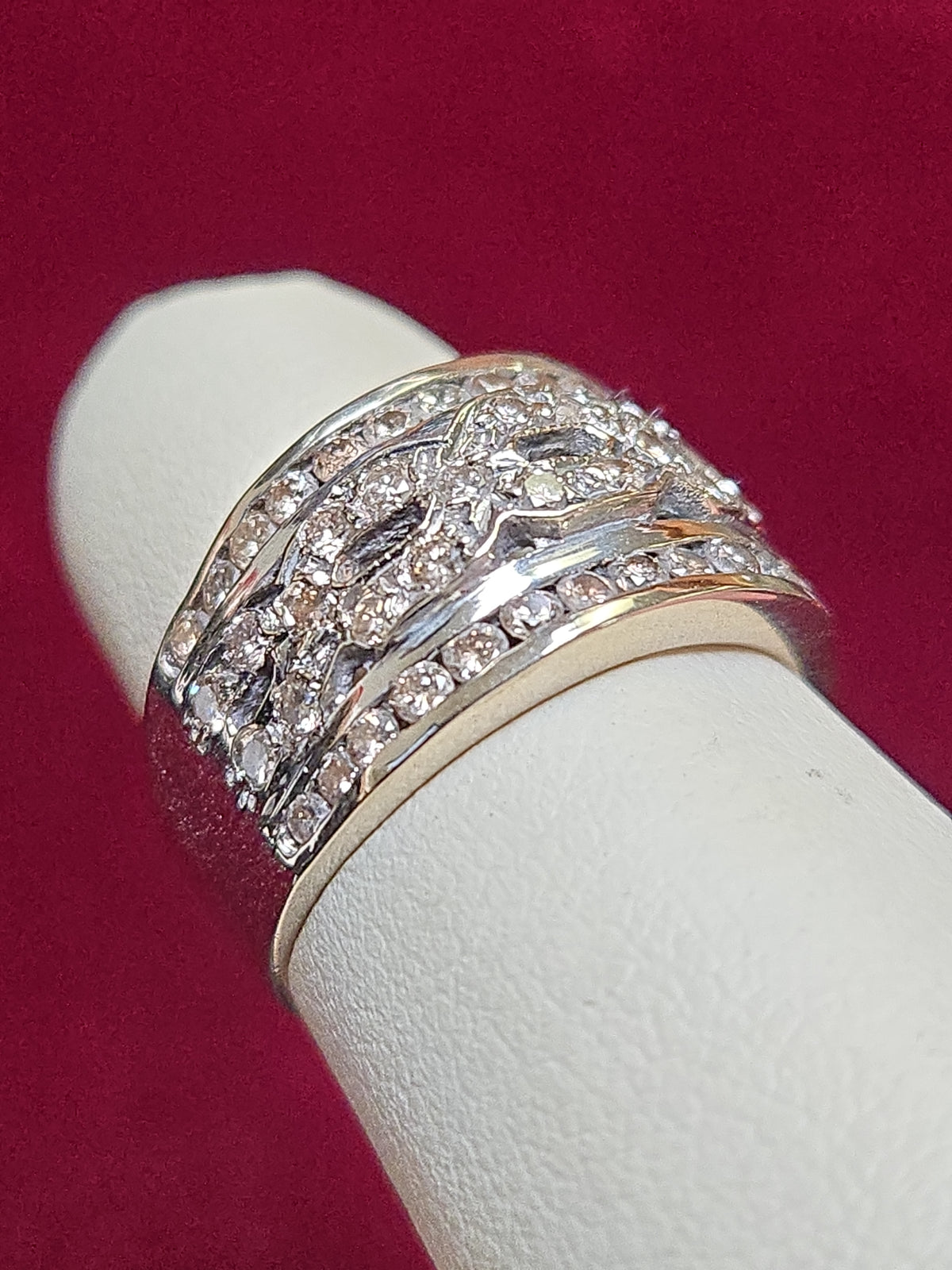 14K white gold ring with 0.6ct round diamonds from Chique Jewelry, showcasing a sparkling diamond-studded band.