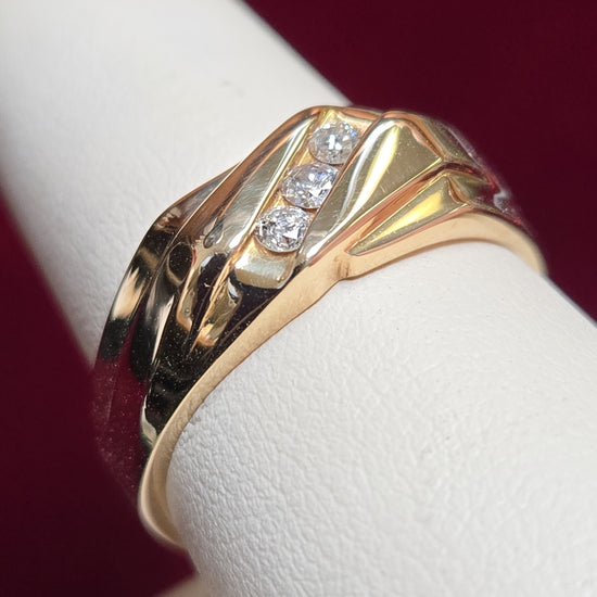 14K gold diamond ring featuring 0.12ct round diamonds and a sleek band design, by Chique Jewelry.