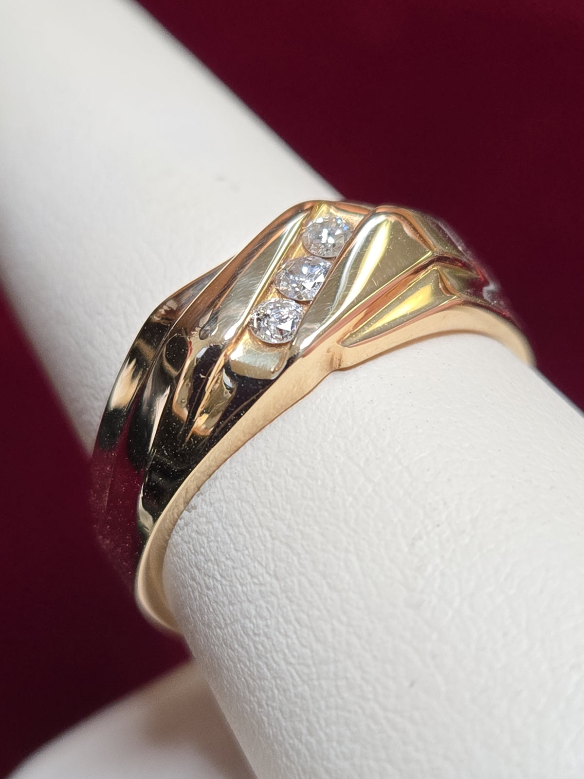 14K gold diamond ring featuring 0.12ct round diamonds and a sleek band design, by Chique Jewelry.